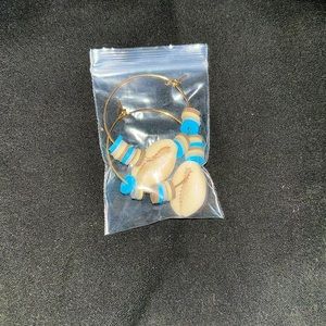 Pair of earrings beach themed